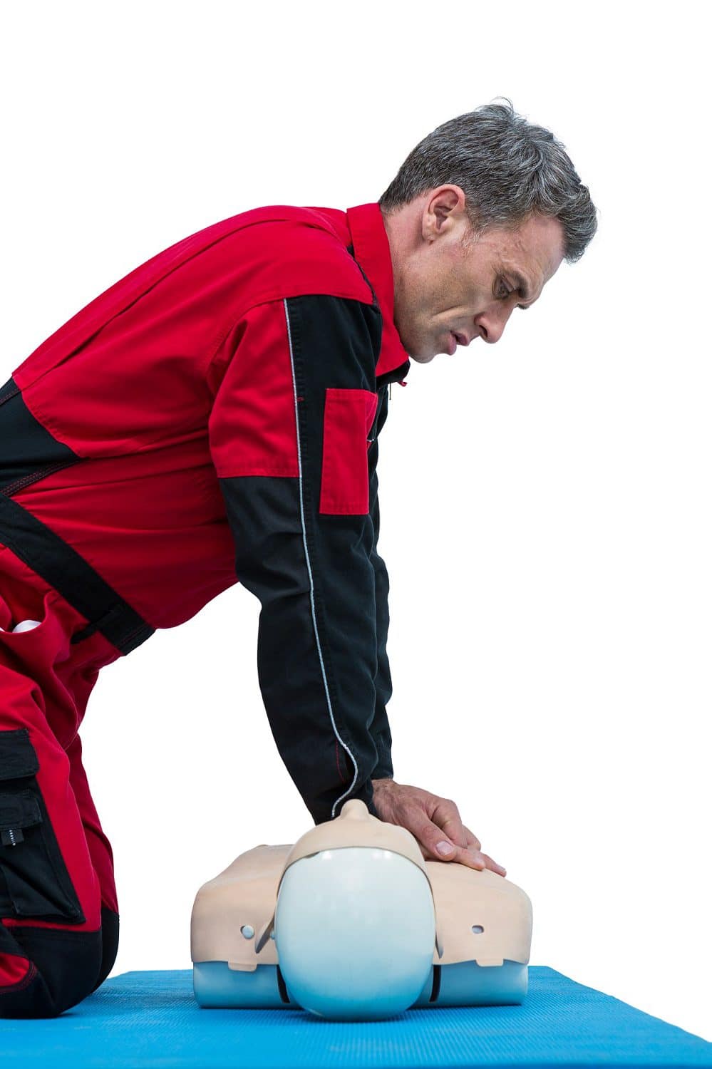 Paramedic Practicing Resuscitation On Dummy