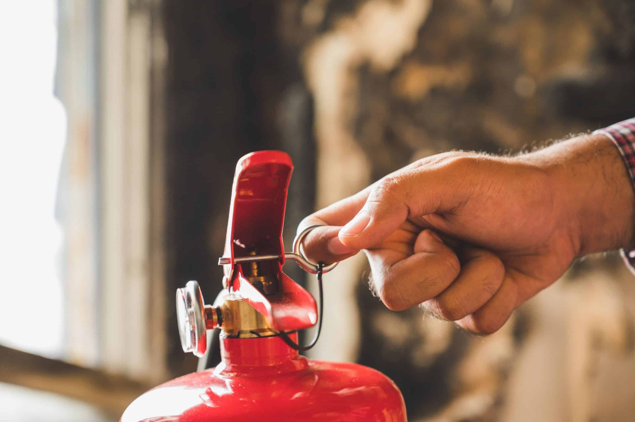 Link Resources chief fire warden activating fire extinguisher during emergency response training