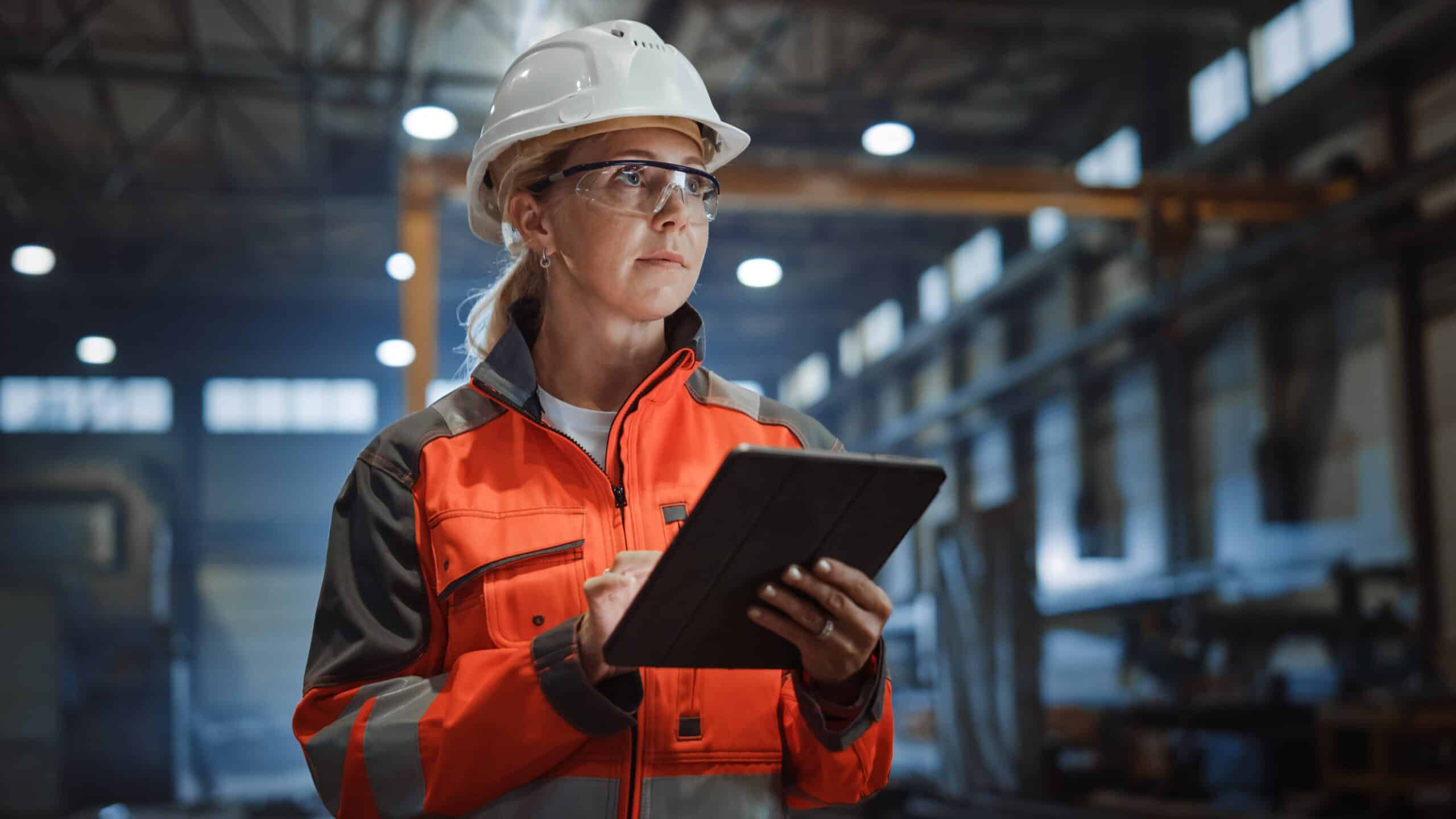 Link Resources excavator operations training construction supervisor inspecting site with tablet